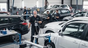 Professional auto body repair shop in Muswellbrook with technicians working on vehicles